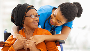 African American female health care practitioner caring for African American female patient