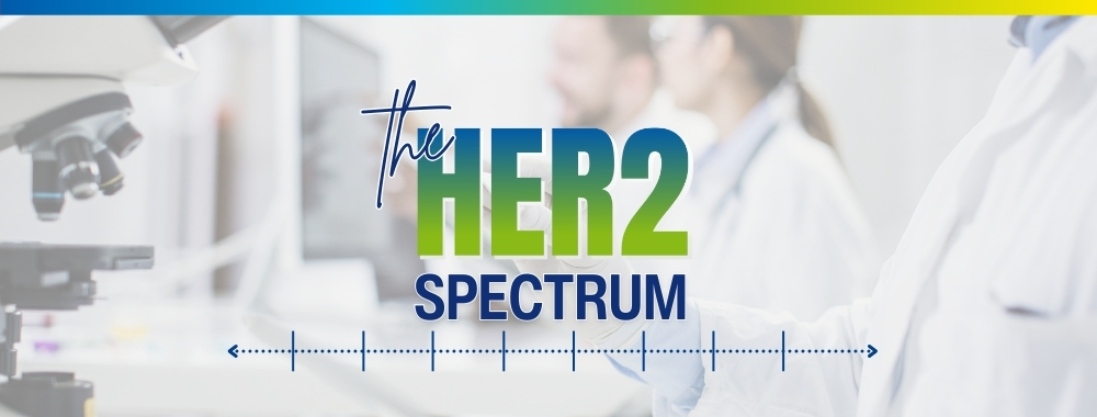 Photo of a laboratory with 'The HER2 Spectrum' in text on top