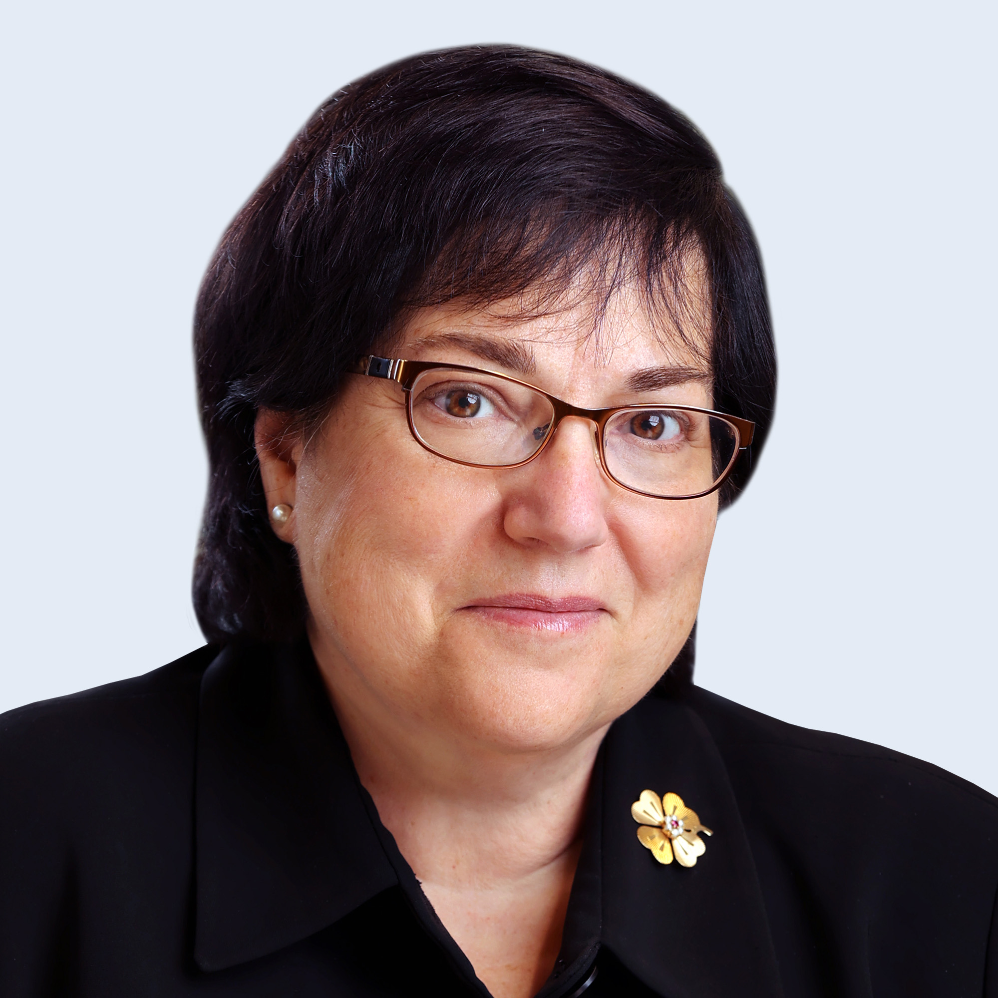 A headshot of Patricia Barbieri in suit