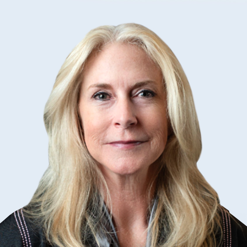 A headshot of Sandy Milligan in suit