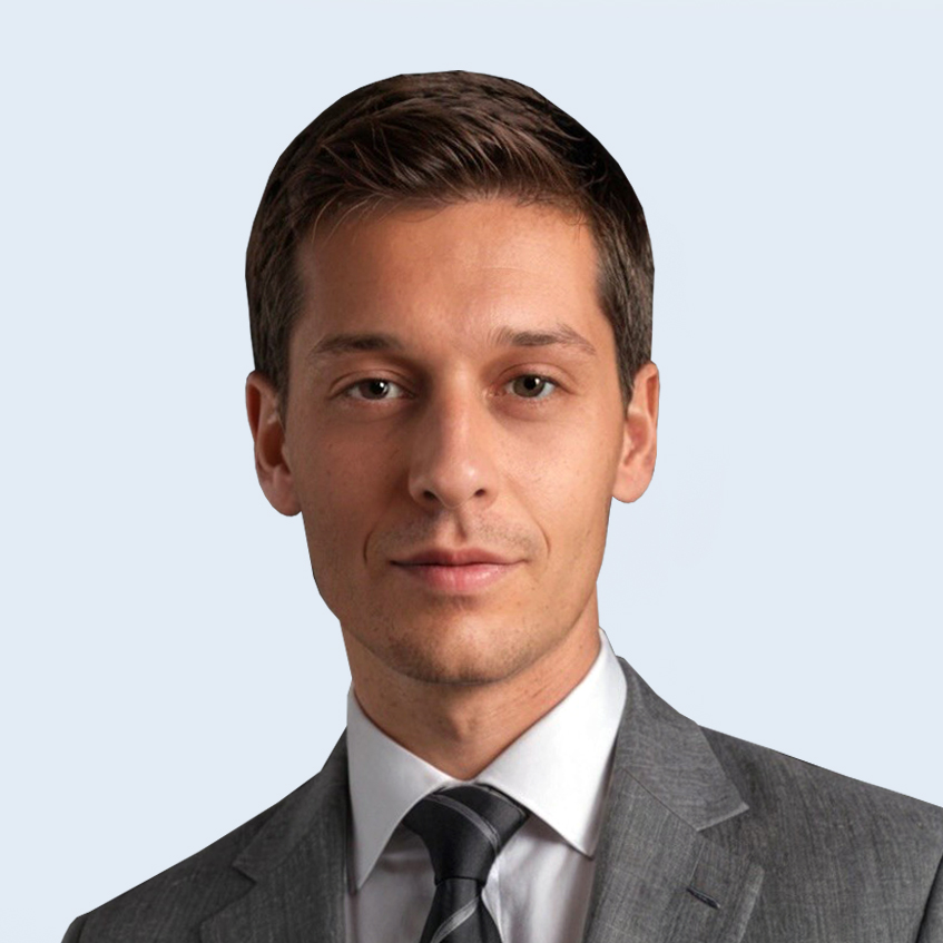 A headshot of Mark Chraplyvy in suit